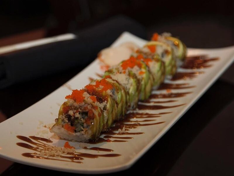 Green Dragon roll topped with sliced avocado